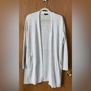 Long sleeve light Heather gray cardigan with zipper pockets.